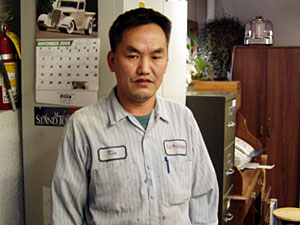 
Kia Pao Lee was a farmer when he and his family came to the United States in 1990 as refugees.  Now he's an auto body technician.   (MPR Photo/Toni Randolph)