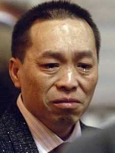 
Earlier in the day, Vang cried while talking to some family members during a break in the murder trial.   (AP Photo/Richard Marshall, Pool)