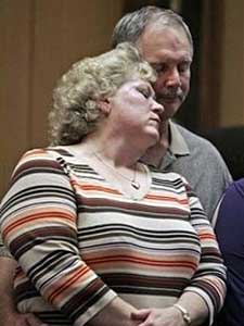 
Shooting victim Terry Willers hugs his wife Theresa after talking to the media Friday afternoon. (AP Photo/Stormi Greener, Pool)