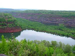 
After mine pits are no longer used, they revert to a more natural state. Mining companies are now trying to contour their pits to be more attractive to developers, once the mining is completed. (MPR Photo/Stephanie Hemphill)