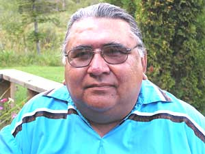 
Tribal elder Paul Schultz is worried that scientists may someday complete the genetic mapping of the wild rice genome. Schultz says that would mean natural wild rice stands could be genetically contaminated. (MPR photo/Tom Robertson)