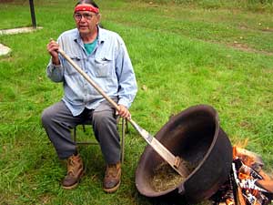 
Hoagland uses an age-old method of drying wild rice over an open fire.  (MPR photo/Tom Robertson)