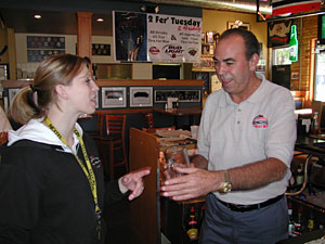 
Tom Reid's Hockey City Pub General Manager Peter Ceruzzi with bartender Jennifer Matten.  Ceruzzi says the pub lost money last year during the NHL lockout. (MPR Photo/Marisa Helms)