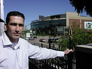
The Liffey's General Manager Valid Serhan stands on the pub's new balcony overlooking the Xcel Energy Center.  He says he expects to double his money during the Wild's season with 44 home games. (MPR Photo/Marisa Helms)