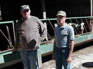 
Farmers Ken Biers, left, and Bill Reisdorf, right, say the tight farm economy means most farmers will use conservation ideas -- only if they get help paying for them.  Reisdorf himself is using runoff control measures on his dairy farm. (MPR Photo/Dan Olson)