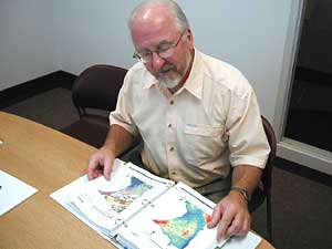
Consultant Gary Oberts is helping write a state stormwater manual that shows how to comply with stormwater rules, and supplies ideas for controlling runoff. (MPR photo/Dan Olson)