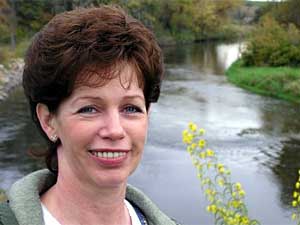 
Mary Hoppe has lined the river near her land with prairie plants to prevent erosion.  Hoppe says she's spent $6,000 dollars on the effort over two years. (MPR Photo/Tim Post)