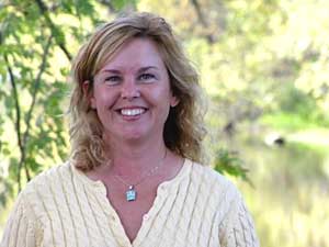 
Julie Klocker with the Sauk River Watershed District says her group has been working to clean up the Sauk River for 20 years.  They spent nearly $4 million so far, but Klocker says the total cleanup price tag would be "hundreds of millions of dollars."  (MPR Photo/Tim Post)
