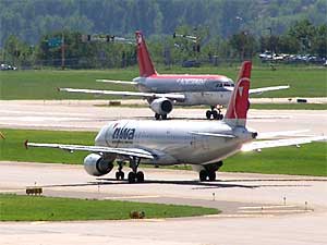 
The FAA says better aircraft avionics, and reform of the country's air traffic control system, will allow planes to land and take off closer together to ease congestion.  (MPR file photo)