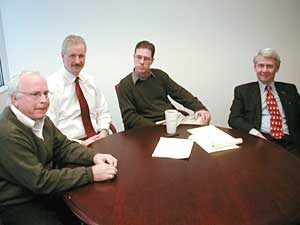 
Attorney Dan Tyson, left, formed a group of private practice attorneys two years ago, including David Graham and Michael Dolan, to combat equity stripping.   (MPR photo/Dan Olson)