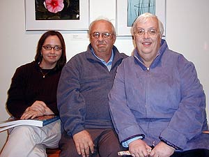 
Elizabeth Max, shown here with her parents, is an avid collector of Walter Anderson art and reproductions. Her mother cross-stitches replicas of Anderson's work onto pillows, one of which (depicting a turtle) she entered in the State Fair last year.  (MPR Photo/Marianne Combs)