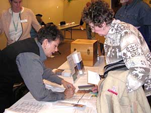 
Seniors picked up information on the drug plan from health insurers. There are 41 individual drug plans available, plus another 20 plans that piggyback on the Medicare health plan.  (MPR Photo/Lorna Benson)