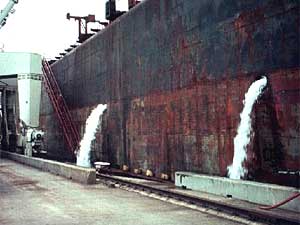 
An oceangoing ship dumps its ballast water while in port. This practice has led to the spread of invasive species in the Great Lakes. (Photo by L. David Smith, MIT Sea Grant)