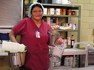 
St. Luke's Hospital recycles food service items like large cans and jars.  The kitchen also saves unused meals for the local food bank, and sends food waste to the compost pile. (MPR photo/Stephanie Hemphill)
