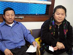 
Chue Vang and Roseann Lo are seeing a doctor before they travel to Laos in December. This will be the first time they return to Laos since they left more than a decade ago. Lo is afraid to eat chicken during their trip for fear of contracting bird flu.  (MPR Photo/Bianca Vazquez Toness)