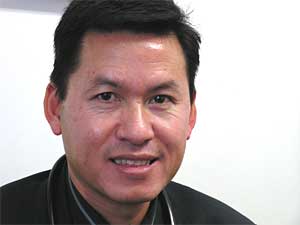 
Dr. Peter Yang has a private medical clinic in St. Paul, where he primarily treats Hmong immigrants. Yang is worried about his patients who are traveling to Southeast Asia this winter to celebrate the Hmong New Year. He fears they are in danger of contracting bird flu.  (MPR Photo/Bianca Vazquez Toness)