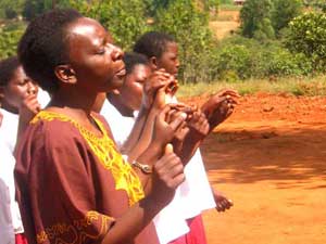 
Priska Msiska leads the HIV Club choir at the Lura Secondary School in one of her original compositions. (Photo: Jonah Eller-Isaacs)