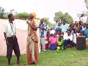 
A drama troupe performs for a rapt audience at the opening of the Iki-Iki AIDS Community Initiative office in eastern Uganda. (Photo: Jonah Eller-Isaacs)