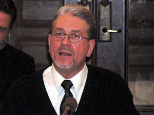 
Dale Case, an area resident asked, "If I invited you to my home to discuss PFOS issues and I offered you a nice tall glass of water from my faucet would you drink it? Second question is just how many tall glasses of water do you think I gave to my wife, my children and my dogs over the last 30 years."
 (MPR Photo/Lorna Benson)