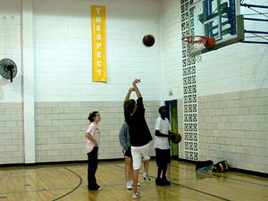
14 year old Farum of Willow Creek Middle School plays basketball with friends at the Rochester Area YMCA. Farum says more 15 and 14 year olds are selling and using drugs. Mothers, he says, should send the abusers back to Africa. 

 (MPR photo/Sea Stachura)