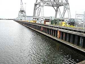 
Sheet steel is used to line harbor walls and the sides of shipping docks.  The docks are filled with earth, which would spill into the harbor if the walls fail.   (MPR Photo/Bob Kelleher)