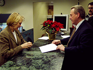 
State Republican Party Chair Ron Carey, right, tries file nomination papers for Kay Ek Tuesday morning with Secretary of State Mary Kiffmeyer, left.   (MPR Photo/Tim Pugmire)