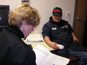 
Carlos Patino recently found out from nurse Merrie Healy that he's pre-diabetic. (MPR Photo/Lorna Benson)