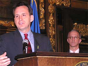 
Gov. Pawlenty said Monday he's pleased that Ford has decided to keep its St. Paul assembly plant open, at least for now. On the right is Matt Kramer, commissioner of Employment and Economic Development.  (MPR Photo/Tom Scvheck)